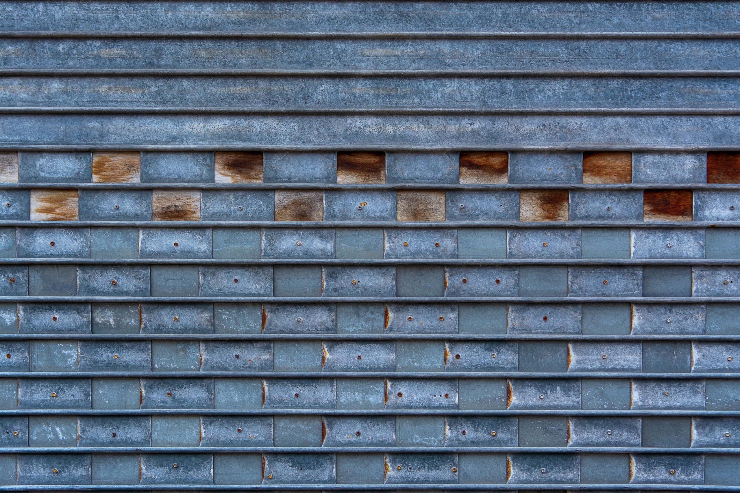 Porte garage metal texture motif brique